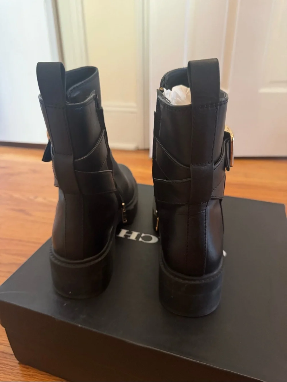 Coach Black Leather Ankle Boots with Gold Buckle Accent